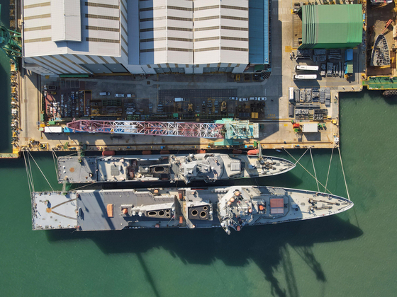 Jeongjo The Great, below, and the ROKS Chungnam frigate warship docked at the HD Hyundai Heavy Industries (HD HHI) shipyard in Ulsan [HD HHI]