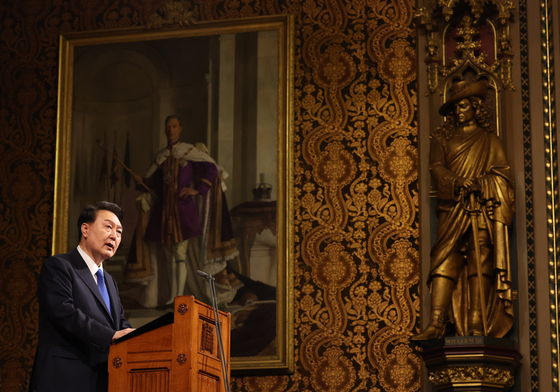 President Yoon Suk Yeol gives an English-language address to both houses of the British Parliament at the Palace of Westminster in London Tuesday during his state visit to Britain. [JOINT PRESS CORPS]