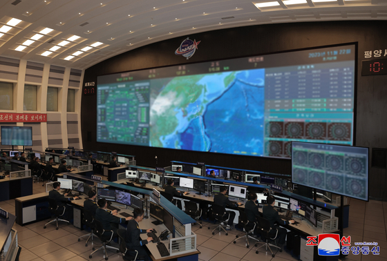 National Aerospace Technology Administration’s Pyongyang General Control Center on Wednesday. North Korea launched its spy satellite on Tuesday. [KOREAN CENTRAL NEWS AGENCY]