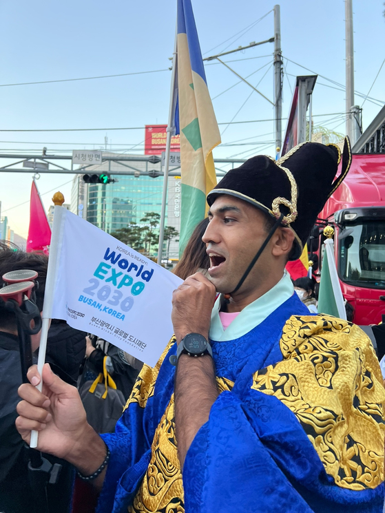 Khan Muhammad Waqas, a member of the Expo Friends campaign promoting Busan’s 2030 World Expo Bid, poses for a photo during a promotional campaign held at Seomyeon Crossroads in downtown Busan on Nov. 21, a week before the final vote for the Expo's host city. [KHAN MUHAMMAD WAQAS]