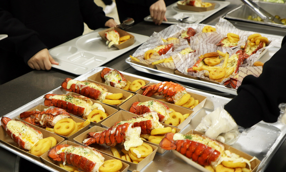 Lobster and potato fries are featured in a domestic school meal offering, reflecting the increasing diversity in culinary choices within the local cafeteria scene. [CJ FRESHWAY]