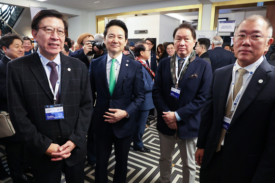 From left, Busan Mayor Park Heong-joon, Jang Sung-min, special envoy of the president and senior secretary for future strategy, SK Group Chairman Chey Tae-won and Hyundai Motor Group Executive Chair Euisun Chung at the Bureau International des Expositions general assembly in France on Tuesday. [YONHAP]