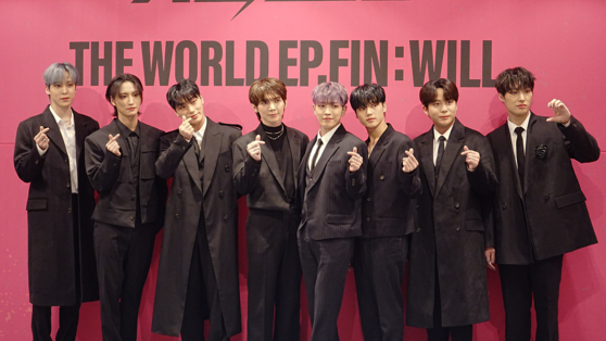Boy band Ateez poses for photos during a press conference for its second full-length album ″The World Ep.Fin: Will″ on Friday, held at the Andaz hotel in southern Seoul. [KIM MYEONG-JI]
