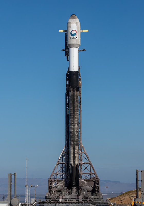 SpaceX's Falcon 9 rocket with South Korean reconnaissance satellite mounted is raised for liftoff at the Vandenberg Space Force Base in California. [MINISTRY OF DEFENSE]