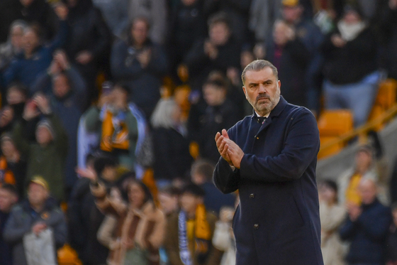Tottenham manager Ange Postecoglou claps at the end of the Premier League soccer match between Wolverhampton Wanderers and Tottenham in Wolverhampton, England in November. [AP/YONHAP]