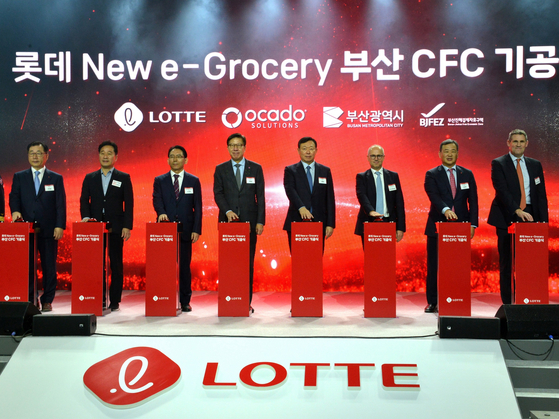 Lotte Shopping held a ground-breaking ceremony for its Busan Customer Fulfillment Center (CFC) on Tuesday, with key officials including Lotte Chairman Shin Dong-bin, fourth from right, and Ocado CEO Tim Steiner, third from right, in attendance. [LOTTE SHOPPING]