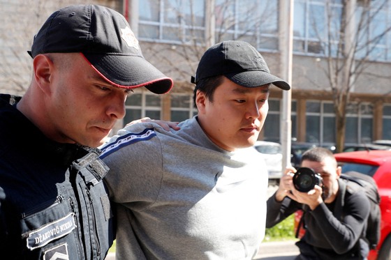 Do Kwon, the cryptocurrency entrepreneur who created the failed Terra (UST) stablecoin, is taken to court in Podgorica, Montenegro, on March 24, 2023. [REUTERS/YONHAP]