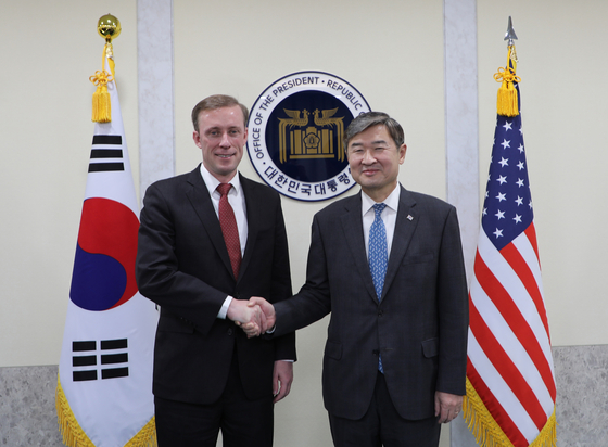 Korean National Security Adviser Cho Tae-yong, right, poses for a photo with U.S. National Security Adviser Jake Sullivan at the Yongsan presidential office in central Seoul Friday. [PRESIDENTIAL OFFICE]