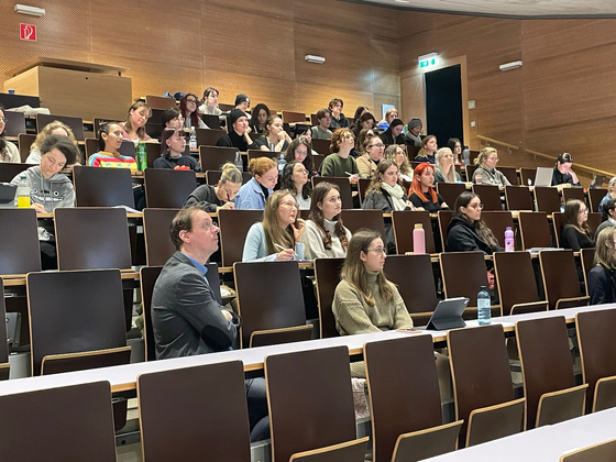 Jerome de Wit, head of the Korean Studies department at Vienna University in Austria, far left front row, with students of the department in a guest lecture on campus on Nov. 14. [UNIVERSITAT WIEN]