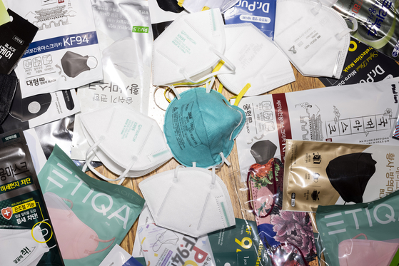 A pile of masks in a testing lab in Minneapolis, Minn., on Monday, Nov. 22, 2021. Two mask companies are shutting down as a once sought-after item becomes an afterthought. [Jenn Ackerman/The New York Times]
