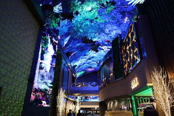 Lights flash at “Aurora,” a state-of-the-art digital entertainment street featuring large LED screens at Mohegan Inspire Entertainment Resort in Incheon on Wednesday. The resort held a soft opening for its hotels, multipurpose arenas, ballroom and restaurants, as well as Aurora, on Nov. 30. The 2023 Melon Music Awards took place at the resort's Inspire Arena, where K-pop star Taemin's solo concert will also take place this weekend. Inspire plans to open the entire resort by the first half of 2024. [YONHAP]