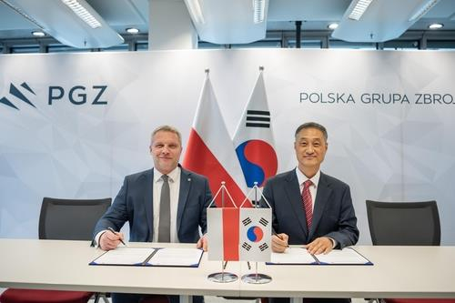 This photo provided by Korea Aerospace Industries Co. shows the company's memorandum of understanding signing ceremony held with Polish defense firm WZL-2 in Warsaw on Dec. 11, 2023. [KOREA AEROSPACE INDUSTRIES]