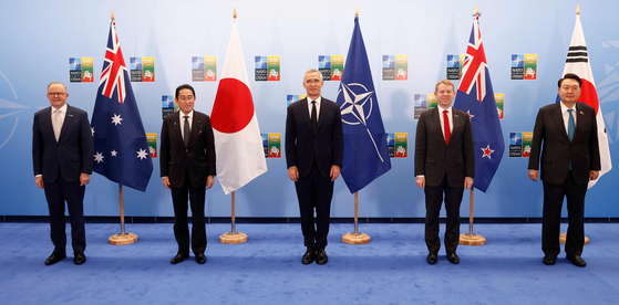 From left, Australia's Prime Minister Anthony Albanese, Japan's Prime Minister Fumio Kishida, NATO Secretary General Jens Stoltenberg, New Zealand's Prime Minister Chris Hipkins and South Korea's President Yoon Suk Yeol pose for a photo before a meeting of the North Atlantic Council with Asia Pacific partners during the NATO Summit in Vilnius, Lithuania, on July 12. [AFP/YONHAP] 
