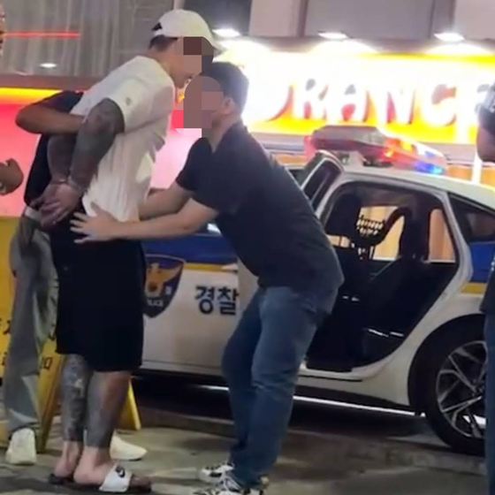 A 28-year-old Rolls-Royce driver who ran over a woman in her 20s in Apgujeong-dong, Gangnam District, southern Seoul is shown to have tattoos all over his arms and legs. [JOONGANG PHOTO]