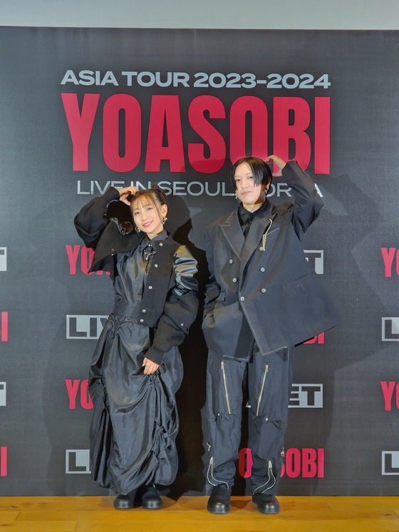Japanese project group Yoasobi poses for the camera during a press conference held Monday in central Seoul. [LIVET]