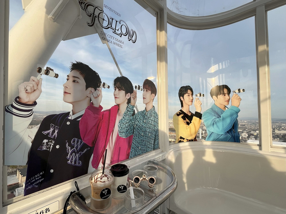 The Redhorse Osaka Wheel wrapped with images of members of Seventeen [HYBE JAPAN]