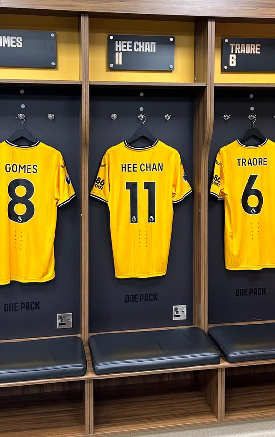 Hwang Hee-chan's shirt hangs in the Wolverhampton Wanderers locker room at the Molineux in Wolverhampton on Thursday.  [JIM BULLEY]