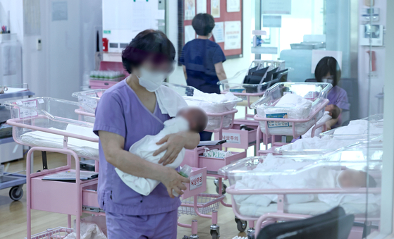 A newborn nursery at a public postpartum care center in Seoul on Tuesday. President Yoon Suk Yeol ordered a fundamental shift in policies to tackle Korea’s low fertility rates at the last Cabinet meeting of the year on Tuesday. Korea’s fertility rate was 0.78 last year, the lowest among the member states of the Organisation for Economic Co-operation and Development and the second lowest in the world. According to Statistics Korea, Korea’s total population will decrease to 36.22 million by 2072, with more than half the population being older than 60. [YONHAP]