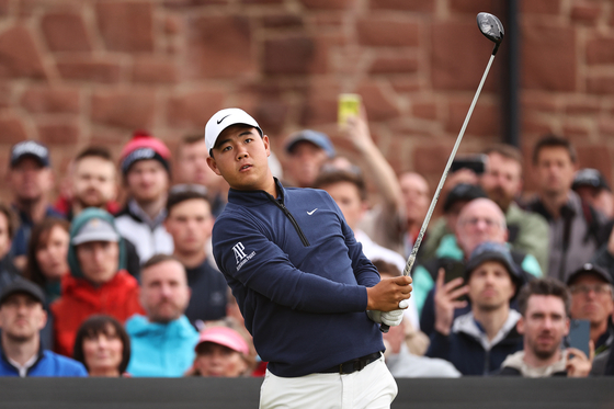Tom Kim tees off on the 3rd hole during Day Four of the Genesis Scottish Open at The Renaissance Club in Berwick, Scotland on July 16, 2023.  [GETTY IMAGES]