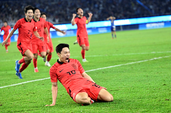 Korea celebrates winning the men's football gold medal match against Japan at the 19th Asian Games in Hangzhou, China on Oct. 7. [XINHUA]
