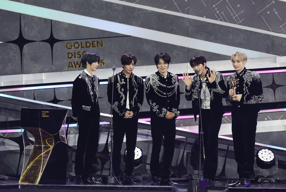 Boy band Tomorrow X Together gives a speech after winning the Best Album of the Year award at the 38th Golden Disc Awards on Saturday at the Jakarta International Stadium (JIS) in Indonesia. [GOLDEN DISC AWARDS ORGANIZING COMMITTEE]