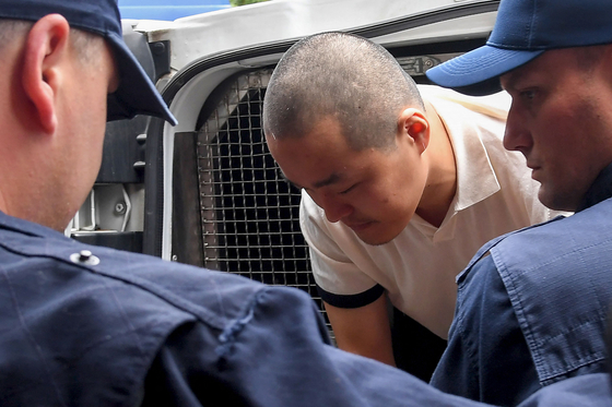 Korean cryptocurrency entrepreneur, co-founder of Terraform Labs (Terra Luna), Do Kwon, is taken to court in Podgorica on June 16, 2023, following his arrest on March 24 at the Montenegrin capital's international airport. [AFP/YONHAP]
