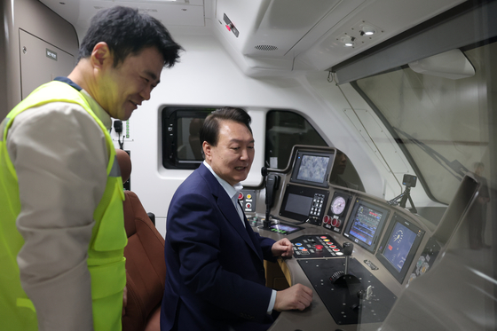 President Yoon Suk Yeol, right, looks around the cockpit of the GTX-A in Dongtan Station, Hwaseong, Gyeonggi, on Nov. 6, 2023. [PRESIDENTIAL OFFICE] 