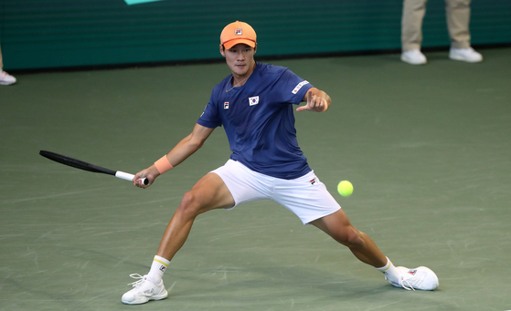 Kwon Soon-woo returns the ball during a match against Belgium's David Goppang during the final round of the 2023 Davis Cup at the Olympic Park Indoor Tennis Court in eastern Seoul on Feb. 5, 2023. [NEWS1]