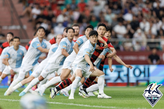 The Pohang Steelers and Ulsan Hyundai, now called Ulsan HD, players in action during a K League match held at Pohang Steelyard in Pohang, North Gyeongsang on July 8, 2023. [YONHAP] 