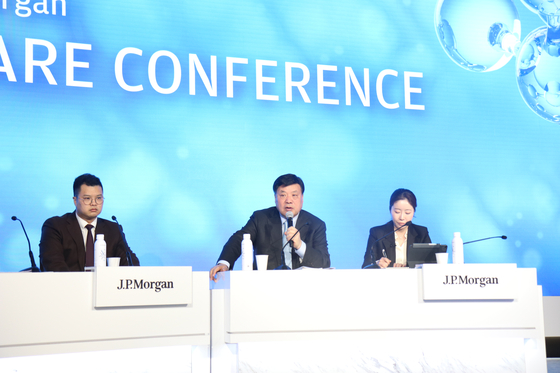 Celltrion Chairman and founder Seo Jung-jin, center, speaks during the 42nd J.P. Morgan Healthcare Conference on Wednesday at the main Grand Ballroom in the Westin St. Francis Hotel, with his son and Celltrion co-CEO Seo Jin-seok, left, on stage. [CELLTRION]