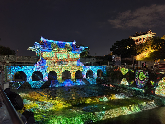 Media art is screened at Suwon Hwaseong Fortress in 2022. [HERITAGE LAB]