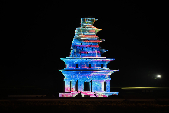 Media art is projected onto the Mireuksa Stone Pagoda in Iksan, North Jeolla. [CULTURAL HERITAGE ADMINISTRATION]