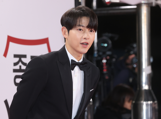 Actor Song Joong-ki poses for photos at the red carpet event for the 44th Blue Dragon Film Awards held at the KBS headquarters in Yeouido, western Seoul, on Nov. 24, 2023. [YONHAP]