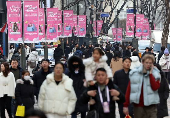 The streets of Myeong-dong in Jung District, central Seoul, are bustling during the 2024 Korea Grand Sale, one of the country's major shopping and tourism festivals, on Jan. 11. The event is part of the government's ongoing Visit Korea Year campaign. [YONHAP]