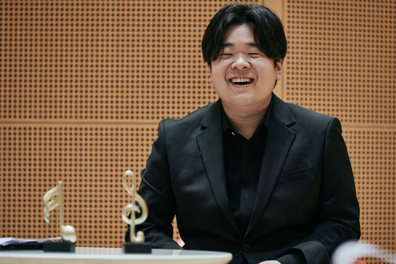 Cellist Han Jae-min speaks during a press conference at Lotte Concert Hall in Songpa District, southern Seoul, on Friday. Han was selected as Lotte Concert Hall’s “In House Artist” this year. [LOTTE CONCERT HALL]