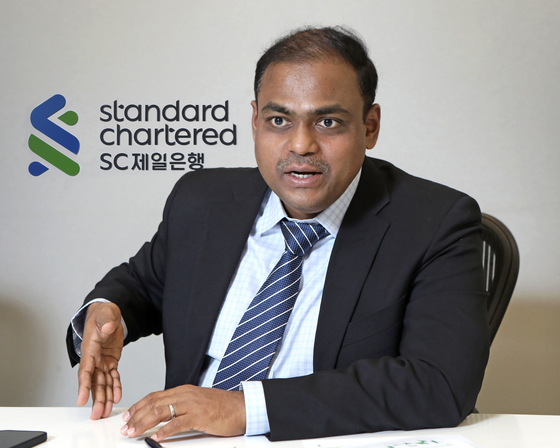 Arup Ghosh, co-head, Asia Rates Research at Standard Chartered Bank, speaks during an interview with the Korea JoongAng Daily at the bank's Seoul office on Jan. 18. [PARK SANG-MOON]