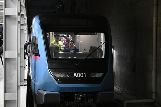 President Yoon Suk Yeol sits in the cockpit of a GTX-A train in Dongtan Station, Hwaseong, Gyeonggi, on Nov. 6, 2023. [JOINT PRESS CORPS]