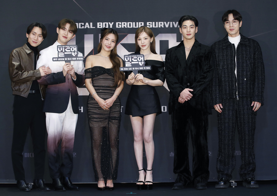 From left, judges Seo Eun-kwang, Kim Jae-hwan, Solar, Wendy, Baekho and Lee Seok-hoon pose for photos during a press conference for Mnet's new survival K-pop program ″Build Up″ at CJ ENM in Mapo District, western Seoul, on Wednesday. [NEWS1]