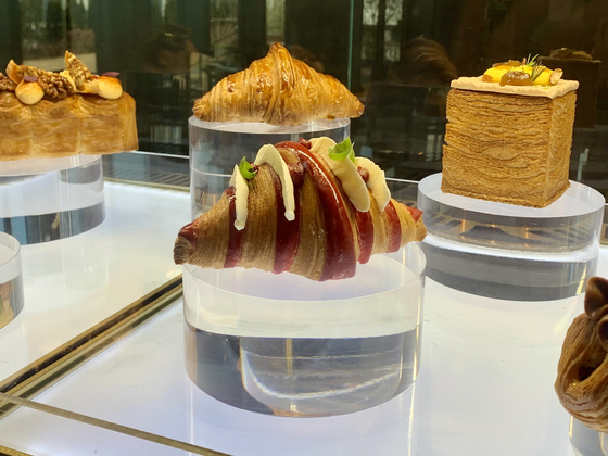 Bom-bi Blossom (7,500 won) croissant infused with cherry blossom cream is part of Sofitel Ambassador Seoul's Haute Croissanterie collection launched celebration of Sofitel brand's 60th anniversary [LEE JIAN]