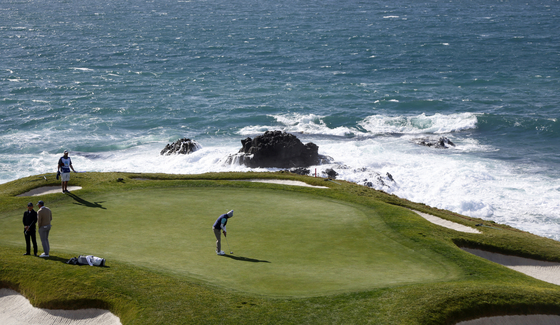 Matt Fitzpatrick of England putts on the seventh green during the third round of the AT&T Pebble Beach Pro-Am at Pebble Beach Golf Links on Feb. 4, 2023 in Pebble Beach, California. [GETTY IMAGES]