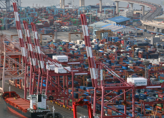 Containers for exports and imports are stacked at a pier in the southeastern port city of Busan on Jan. 1, 2024. [YONHAP]