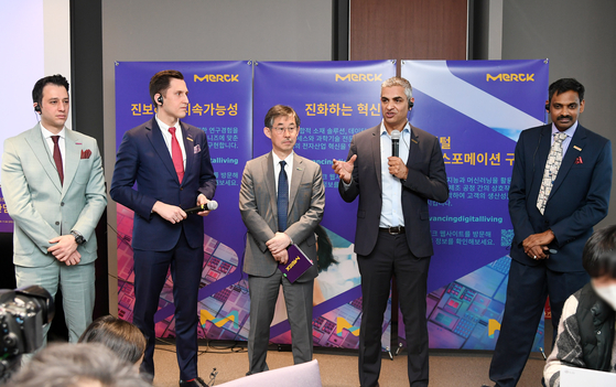 Second from right, Merck's Chief Commercial Officer and Executive Vice President Anand Nambiar speaks at a press event on Friday after keynote speeches given by Merck executives at Shilla Stay Samsung in southern Seoul. [MERCK KOREA]