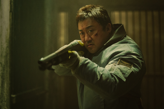 A scene from Netflix apocalyptic film ″Badland Hunters,″ starring Don Lee as Namsn, a skilled hunter wielding various weapons to forage for supplies for his village [NETFLIX]