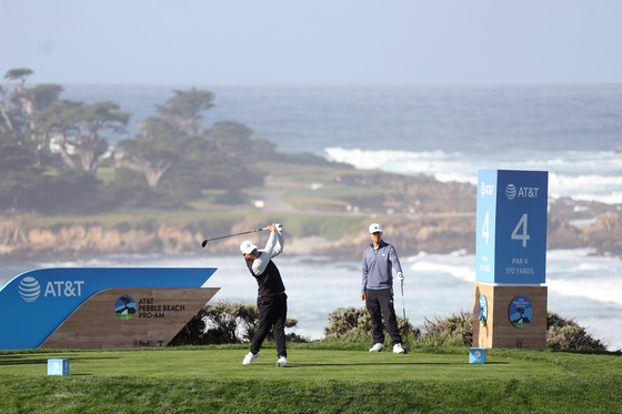 Kim Si-woo plays his shot from the fourth tee during the second round of the AT&T Pebble Beach Pro-Am at Spyglass Hill Golf Course in Pebble Beach, California on Friday.  [GETTY IMAGES]
