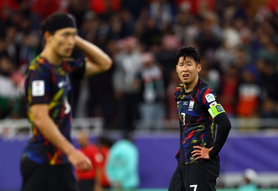 Korea's Son Heung-Min looks dejected as Jordan knock Korea out of the Asian Cup in the semifinals at Ahmed bin Ali Stadium in Qatar on Tuesday.  [REUTERS/YONHAP]