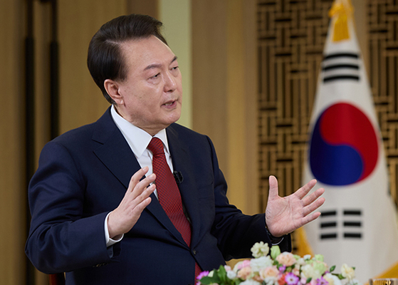 President Yoon Suk Yeol speaks during an interview with public broadcaster KBS at the presidential office in Seoul on Sunday. The interview was aired on Wednesday evening, ahead of the Lunar New Year holiday. [PRESIDENTIAL OFFICE]