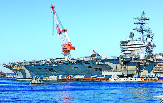 Nimitz-class nuclear-powered aircraft carrier USS Ronald Reagan (CVN-76) oft the U.S. Navy’s Seventh Fleet docked at the Yokosuka Naval Base in Japan, for maintenance on Dec. 6, 2023. [WOO SANG-JO]