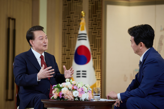 President Yoon Suk Yeol, left, during an interview with the public broadcaster KBS, which was prerecorded before its official airing on Feb. 7. [PRESIDENTIAL OFFICE] 