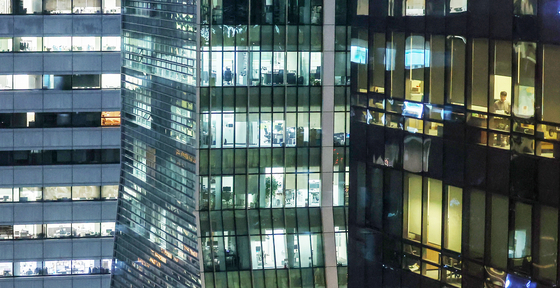 Office buildings in downtown Seoul turned their lights on in the evening last November. [NEWS1] 