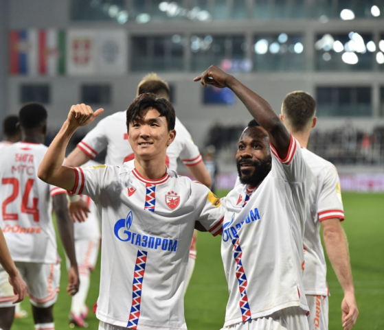 Red Star Belgrade's Hwang In-beom, left, celebrates after scoring a penalty to secure the team's 3-1 victory over Backa Topola on Saturday at TSC Arena in Backa Topola, Serbia. [SCREEN CAPTURE]